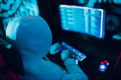 Hacker using computer malware software and hacking binary code digital interface Stock Photos