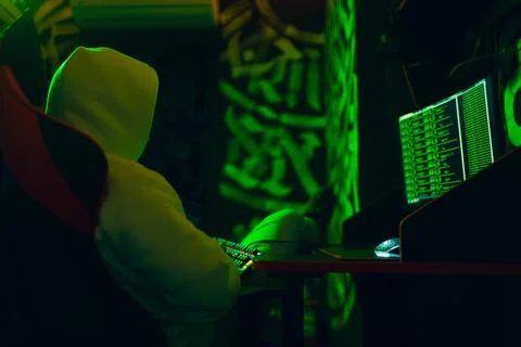 Hacker using computer malware software and hacking binary code digital int... Stock Photos