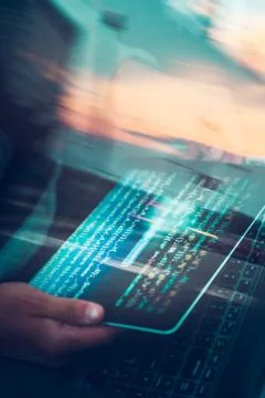 Hacker using computer, smartphone and coding to steal password and private da Foto stock