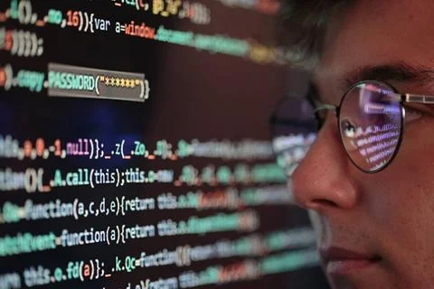 Hacker using computer, smartphone and coding to steal password and private... Foto stock