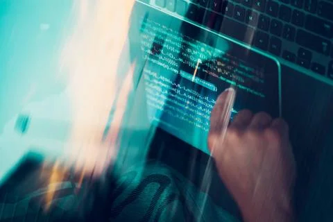 Hacker using computer, smartphone and coding to steal password and private... Stock Photos