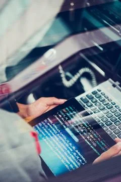 Hacker using computer, smartphone and coding to steal password and private... Stock Photos