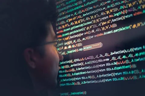 Hacker using computer, smartphone and coding to steal password and private... Stock Photos
