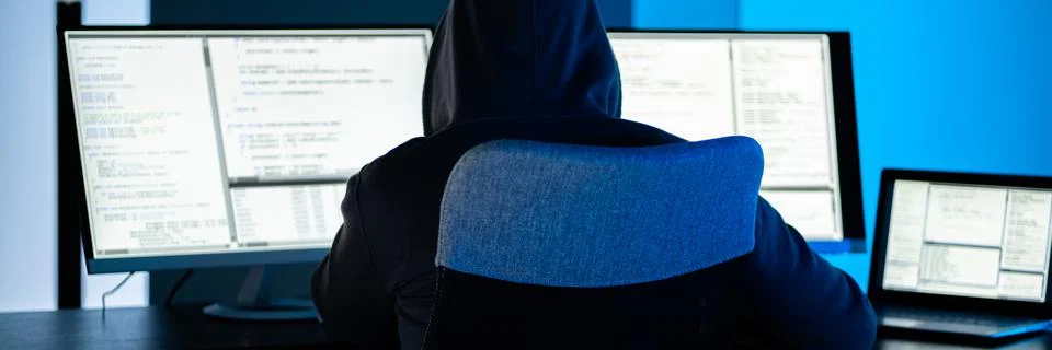 Hacker Using Computer To Write Exploit Stock Photos