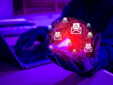 Hacker using email phishing scam to target victims worldwide. Cybersecurity.. Stock Photos