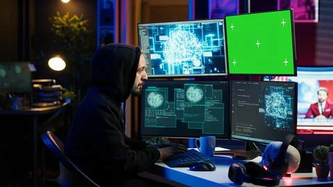 Hacker using green screen PC and AI to find unpatched connections 库存照片