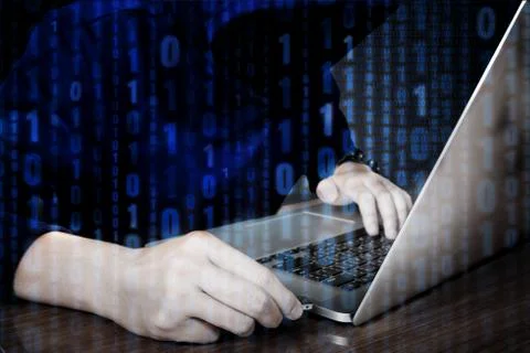 Hacker using keyboard typing bad data into computer online system and sprea.. Stock Photos