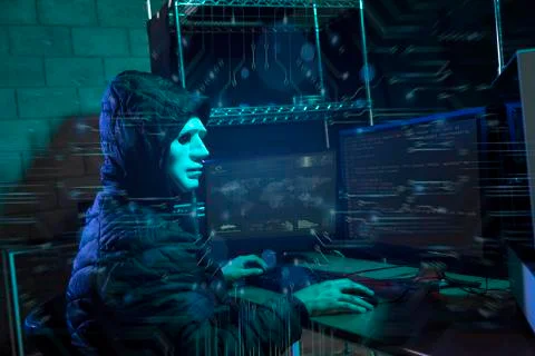 Hacker using laptop with binary code Stock Photos