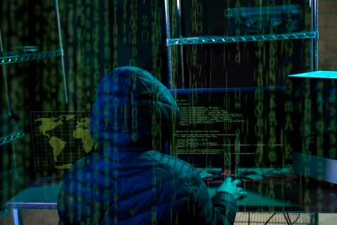 Hacker using laptop with binary code Foto stock