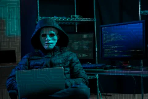 Hacker using laptop with binary code 库存照片