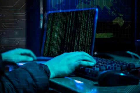 Hacker using laptop with binary code Stockfoto's