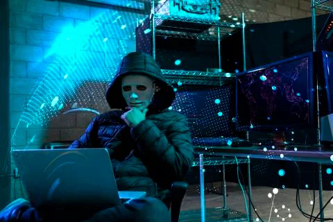 Hacker using laptop with binary code 库存照片