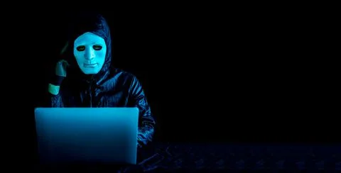 Hacker using a laptop to browse the net and serious face thinking about question Stock Photos