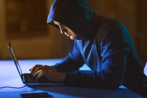 Hacker using laptop computer for cyber attack 스톡 사진