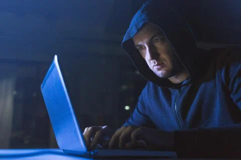 Hacker using laptop computer for cyber attack Foto stock