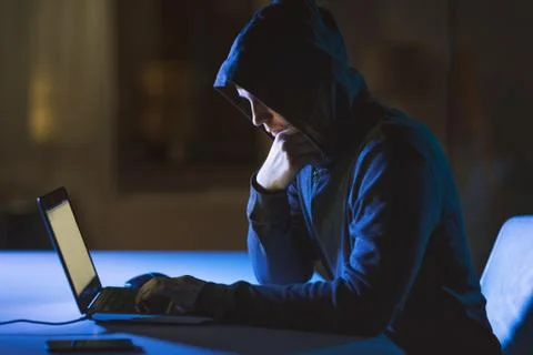 Hacker using laptop computer for cyber attack Foto stock