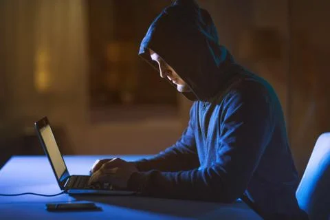 Hacker using laptop computer for cyber attack 스톡 사진