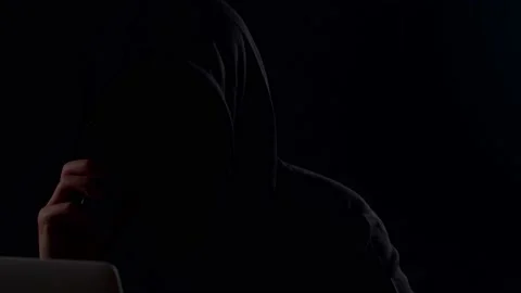 Hacker Using Laptop Computer Hacking And Talking On Phone Stock Footage 157487748