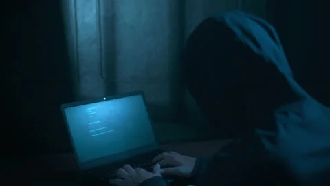 A Hacker is using laptop computer to steal data Stock Footage 146834244