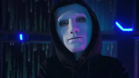 A Hacker is using laptop computer to steal data in the night Stockbeeldmateriaal 232942686