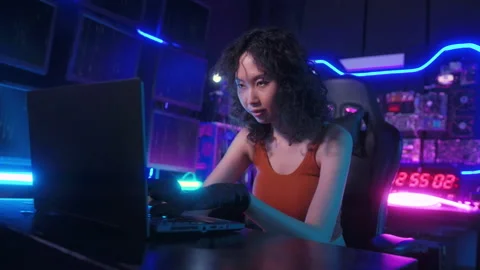 A Hacker is using laptop computer to steal data in the night Stockbeeldmateriaal 232943754