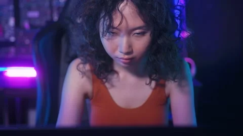 A Hacker is using laptop computer to steal data in the night 動画素材 232943788