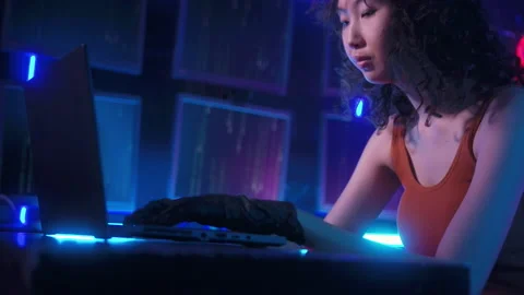 A Hacker is using laptop computer to steal data in the night Stockbeeldmateriaal 232945253
