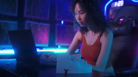 A Hacker is using laptop computer to steal data in the night Stock Footage 232945584