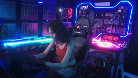 A Hacker is using laptop computer to steal data in the night Stock Footage 232965645