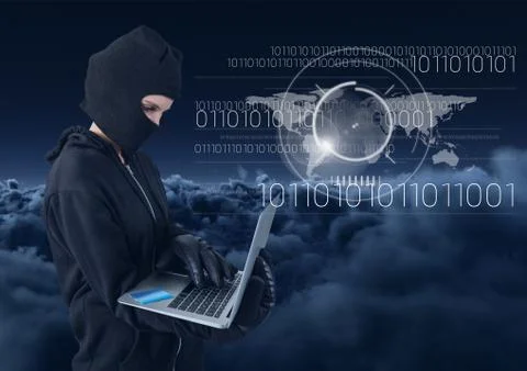 Hacker using a laptop in front of cloudy background 写真素材