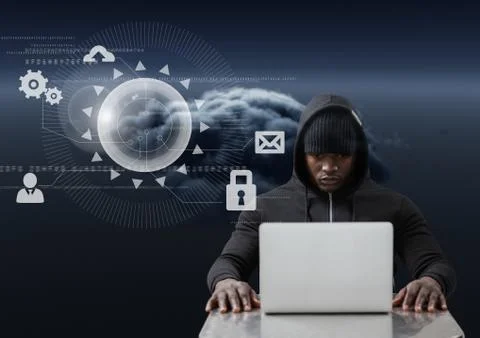 Hacker using a laptop in front of digital graphics Foto stock
