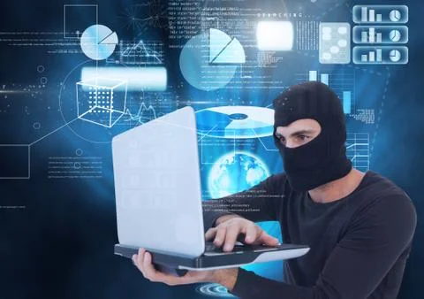 Hacker using a laptop in front of digital background Foto stock