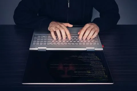  Hacker using laptop. Lots of digits on the computer screen. modern slim ultr 스톡 사진