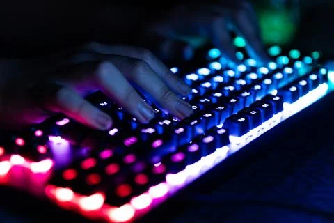 Hacker using laptop. Lots of digits on computer screen. 스톡 사진