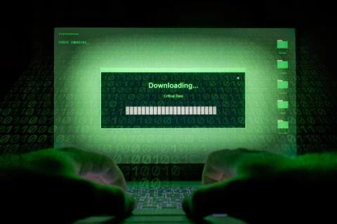 Hacker using laptop. Stock Photos