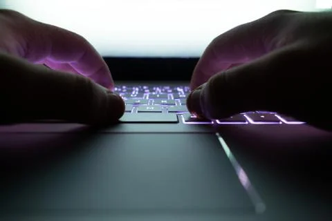 Hacker using laptop. Stock Photos