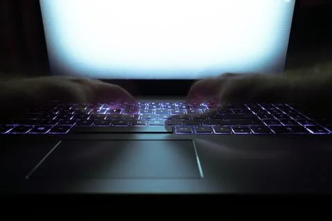 Hacker using laptop. Stock Photos