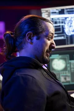 Hacker using machine learning on computer to break into systems 스톡 사진