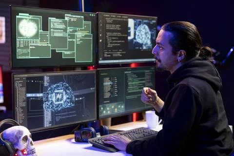 Hacker using malicious virus and artificial intelligence to compromise devices Stock Photos