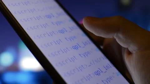 Hacker using phone for cyber attack. digital code on the iphone screen. Stock Footage 231222518