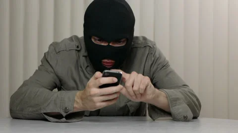 Hacker Using Smartphone To Commit Crime Stock Footage 32219562