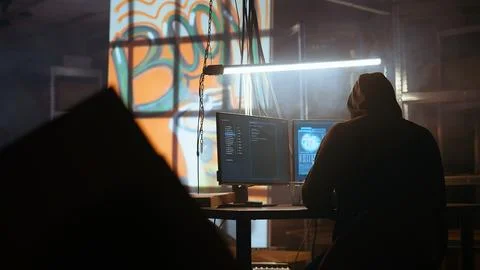 Hacker using software interface on computer screen Stock Photos