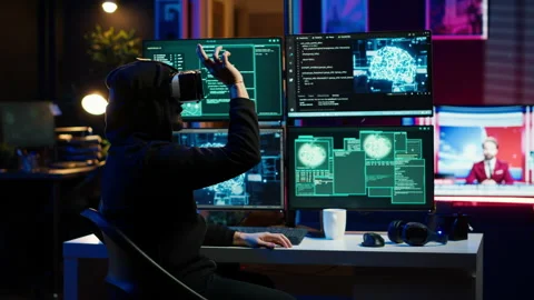 Hacker using virtual reality headset to code malware 库存影片 275864891