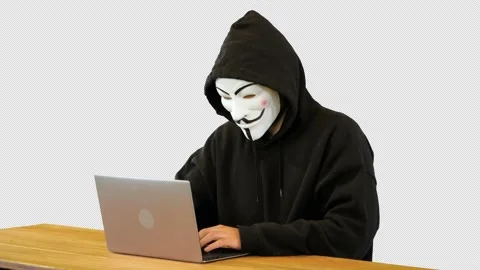 Hacker with Vendetta mask on working on a laptop, Alpha Channel Stock Footage 150947262