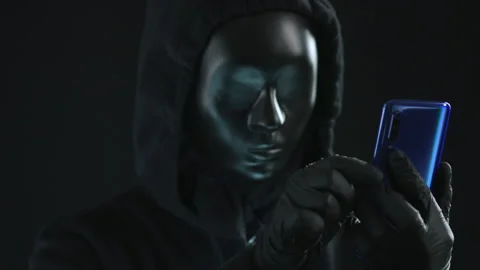 Hacker wearing black mask pulls ERROR tab from a smartphone. Hacking concept Video stock 138144384