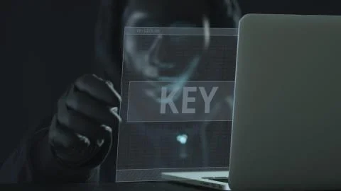 Hacker wearing black mask pulls KEY tab from a laptop Stock-Illustration