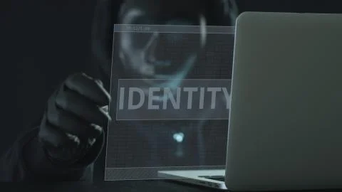 A hacker wearing black mask pulls IDENTITY tab from a laptop. Hacking concept Stock Illustration