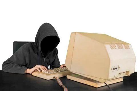 Hacker wearing hoodie using computer Stock Photos