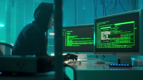 Hacker in a white mask is typing on a computer keyboard and cracking a password Stock Footage 233601731