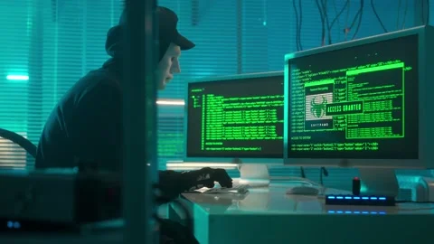 Hacker in a white mask is typing on a computer keyboard and cracking a password Stock Footage 233601978